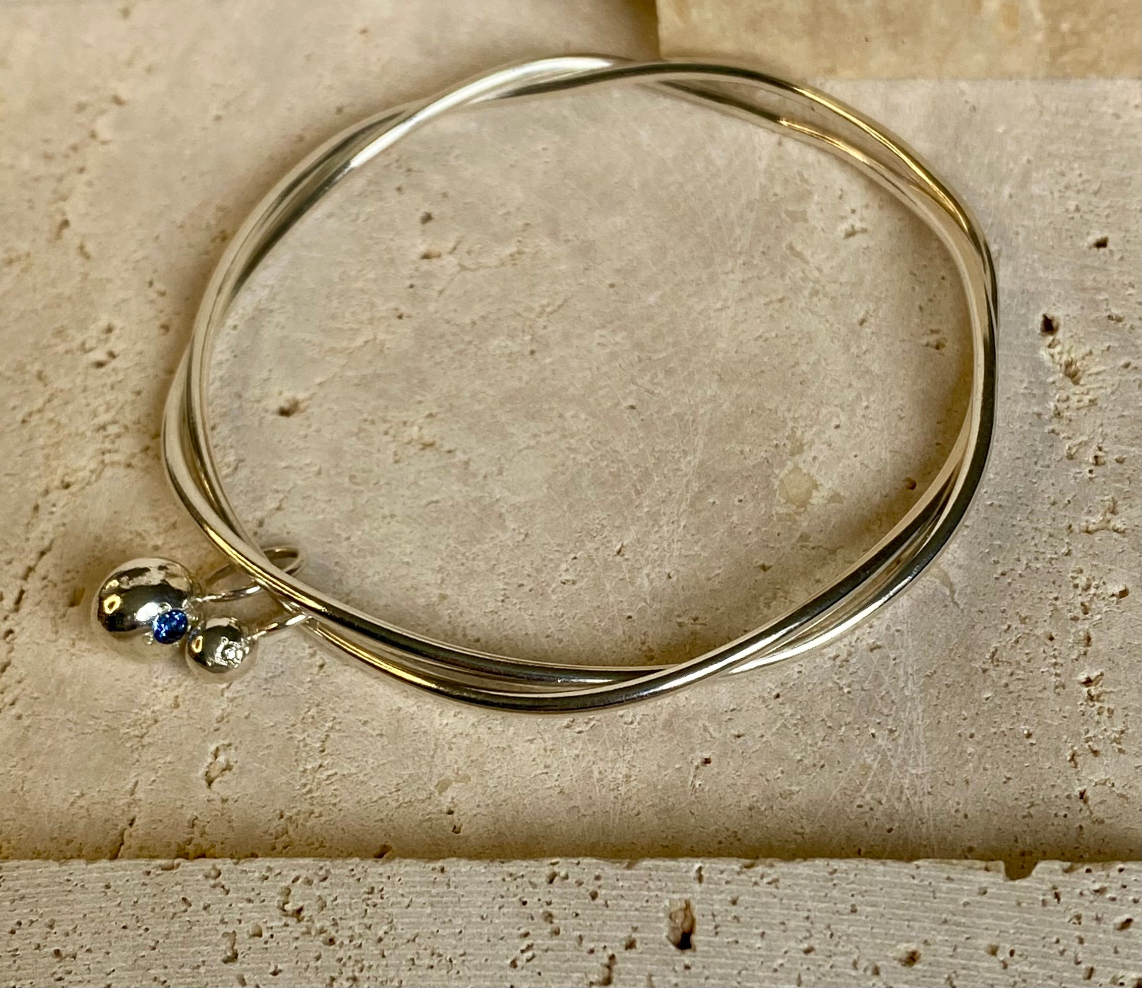 Entwined organic twin Pepita Charms bangle