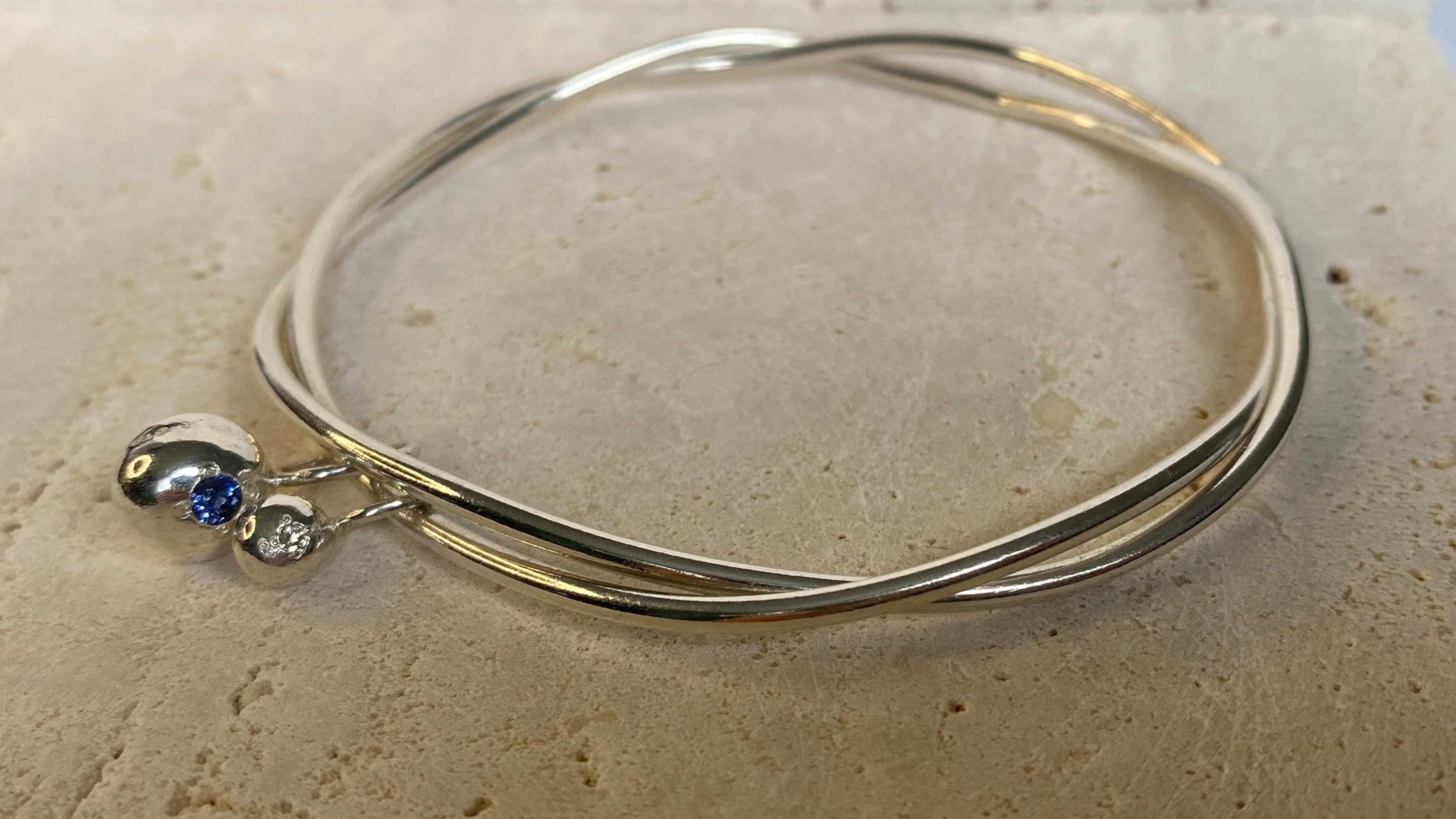 Entwined organic twin Pepita Charms bangle