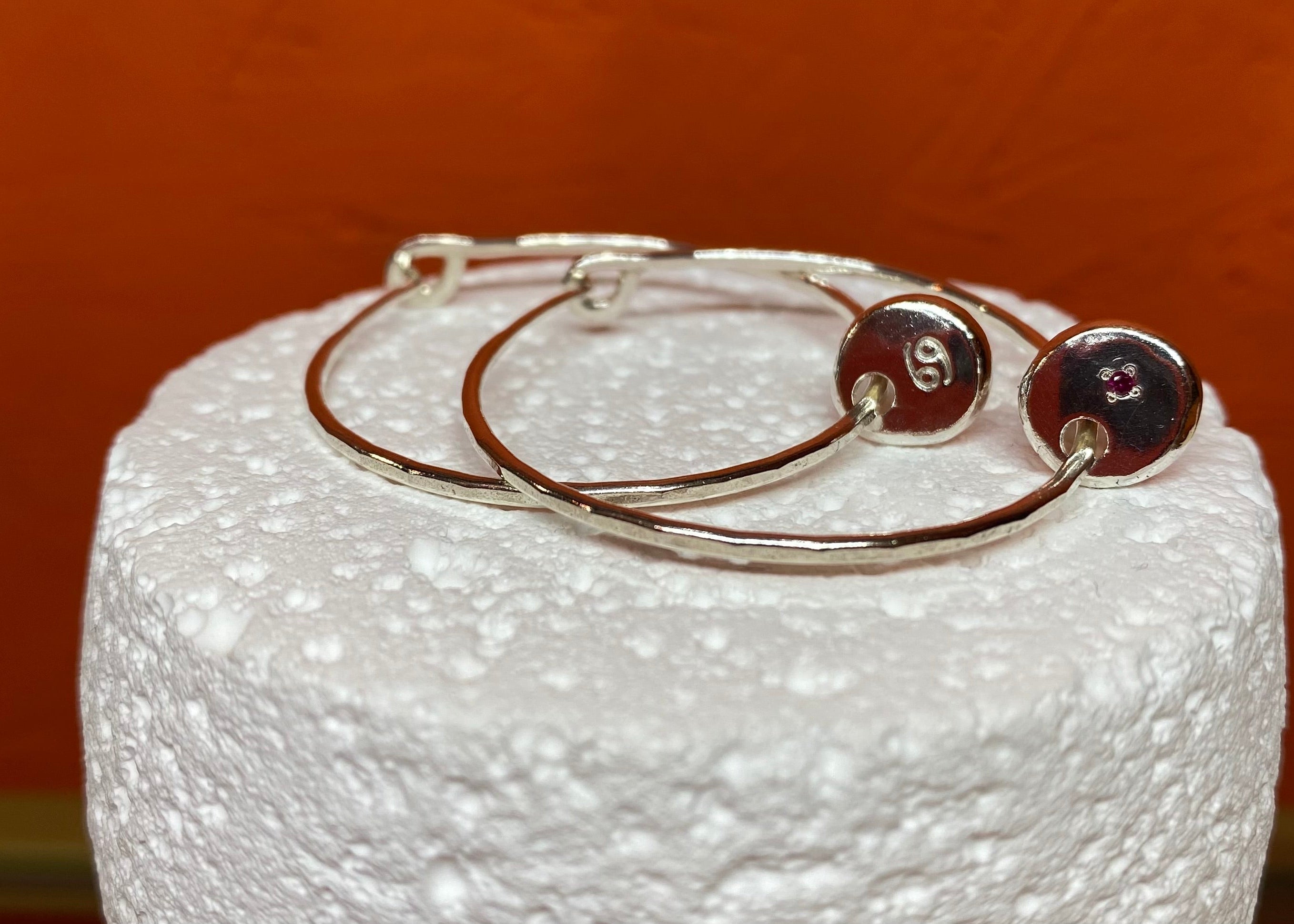 Infinity hoops with Zodiac Coriandoli charm