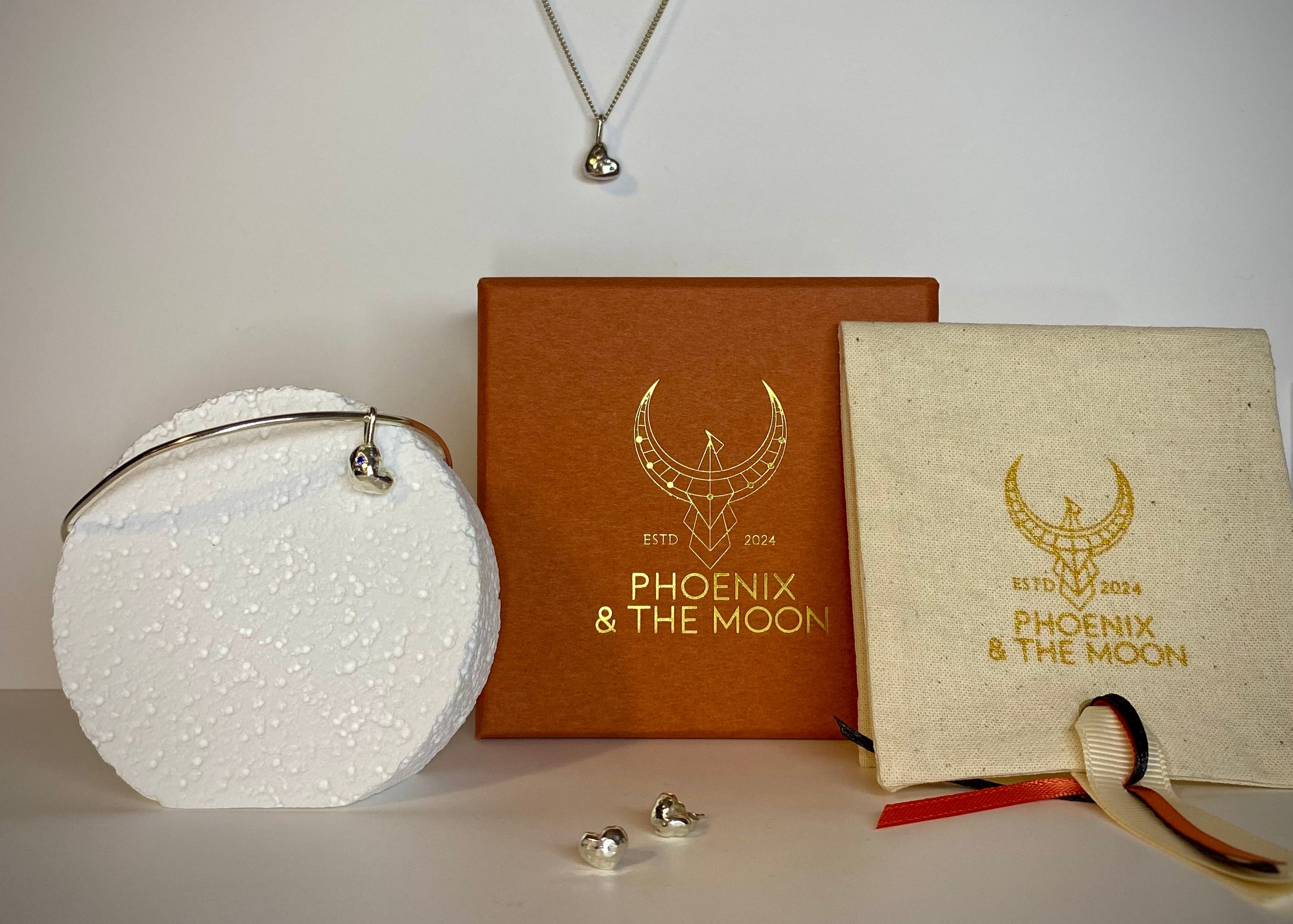 Molten heart charm necklace