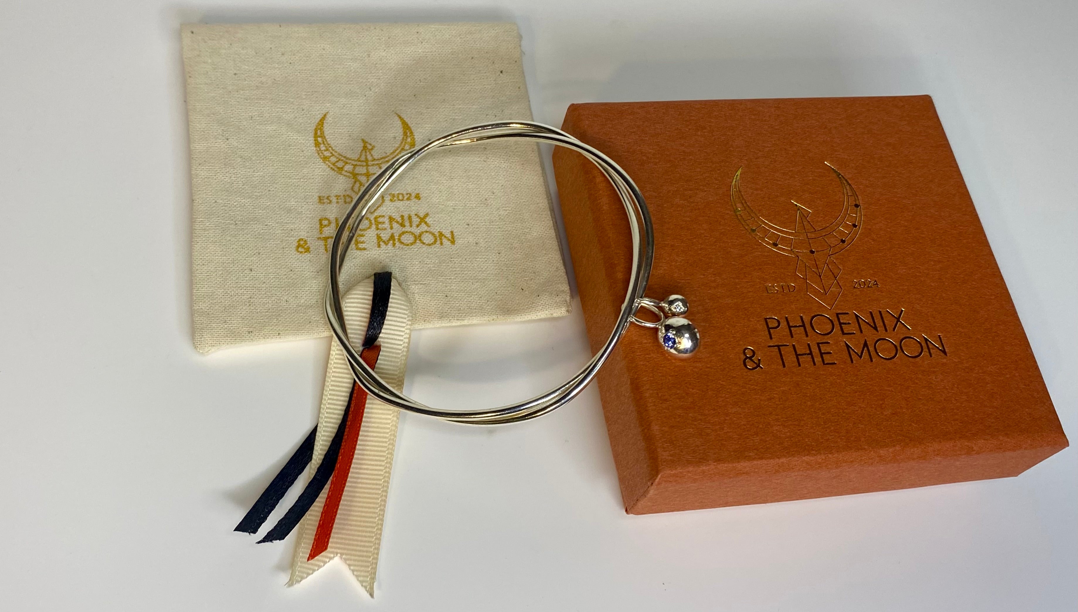 Entwined organic twin Pepita Charms bangle