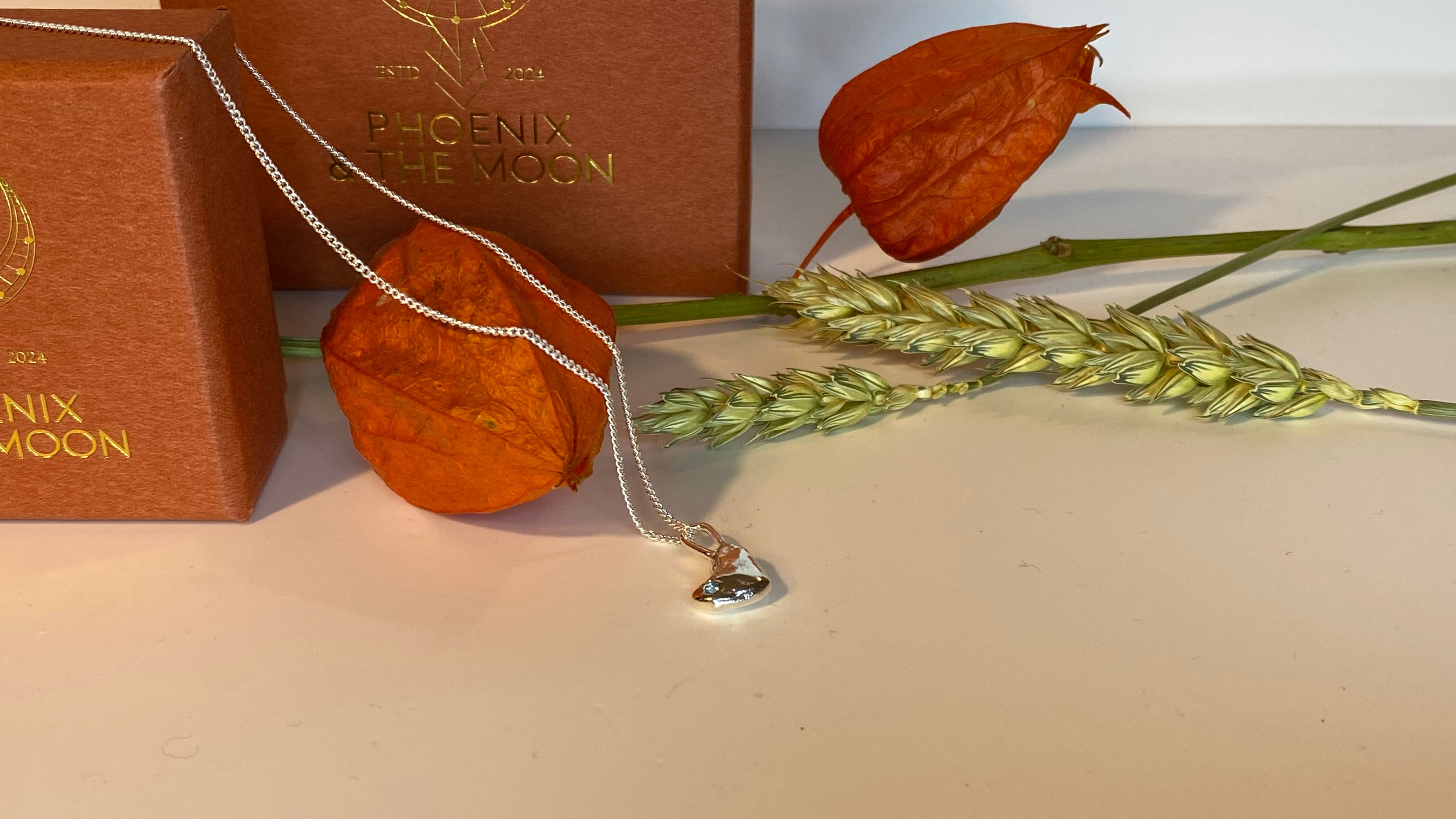 Molten heart charm necklace